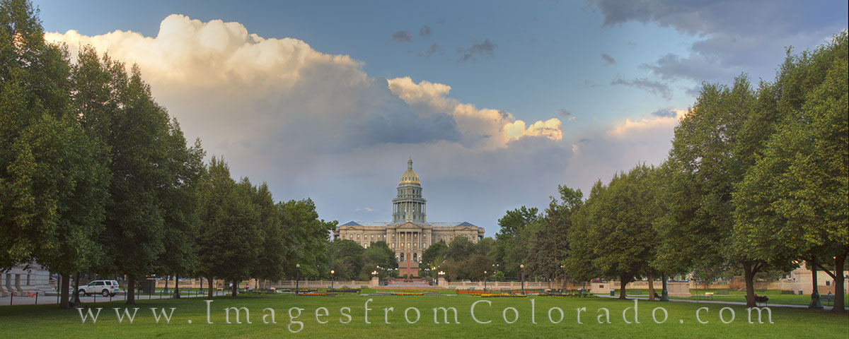 This downtown Denver panorama shows the Colorado State Capitol and Civic Center of the city. With thunderclouds looming in the...
