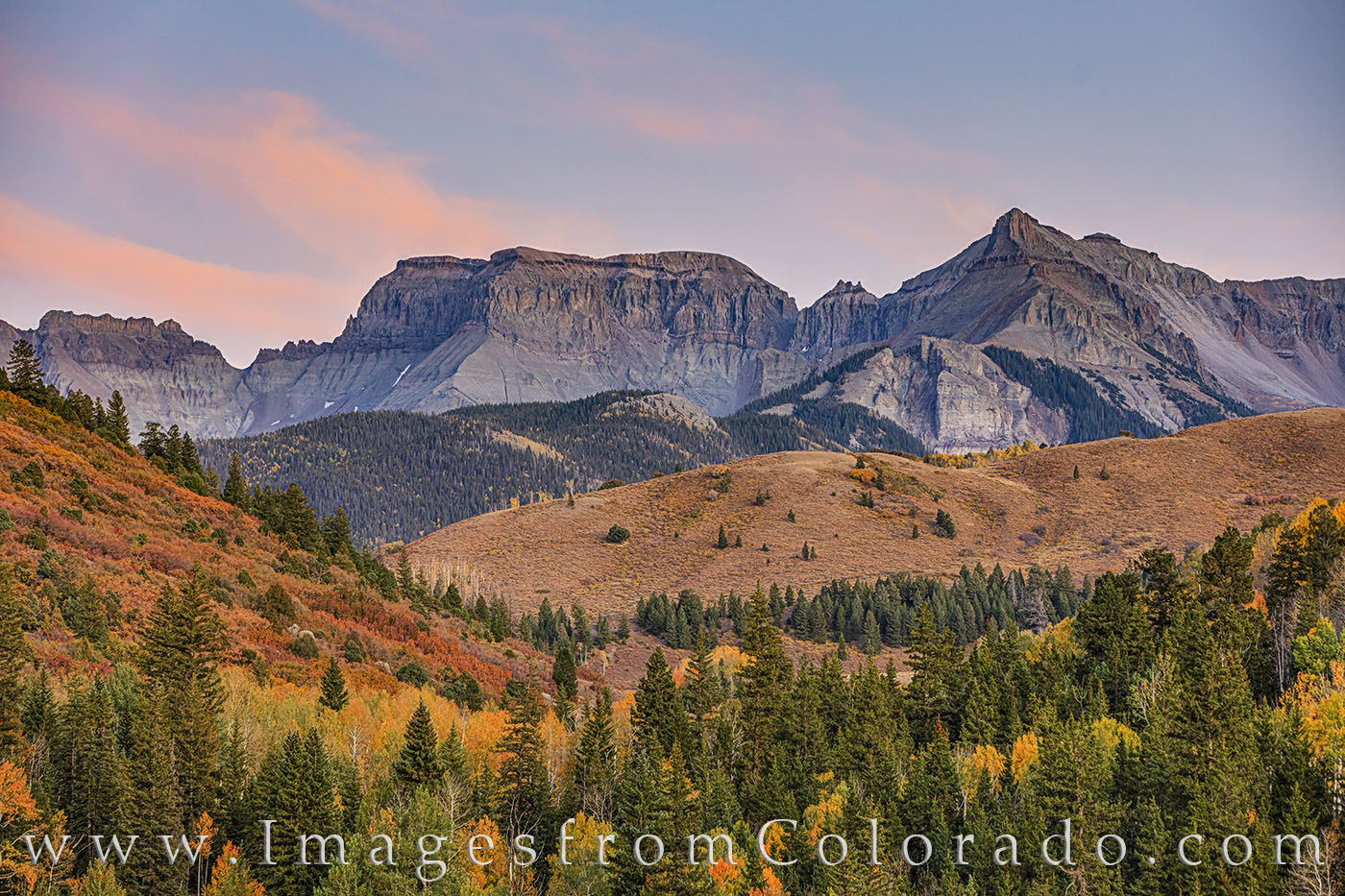 Sunset falls across the Dallas Divide on a cool fall evening in early October. The aspen and scrub showed off oranges and golds...