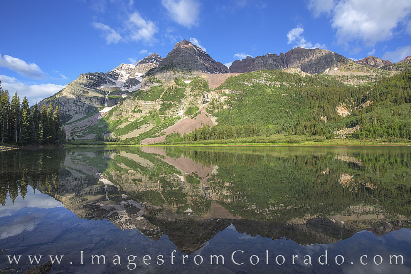 The iconic Maroon Bells show their reflections in Crater Lake in the Maroon Bells. Wilderness Area. This area is a short 2 mile...