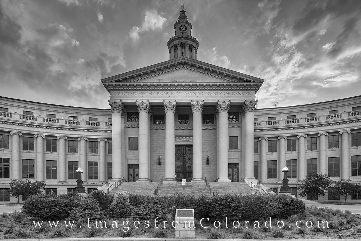 This black and white image from downtown Denver shows the City and County Building. Located in the Civic Center as part of a...