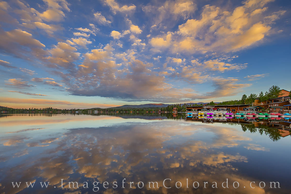 Beautiful clouds hang above Grand Lake and make a beautiful reflection in the still water. This photograph was taken just before...
