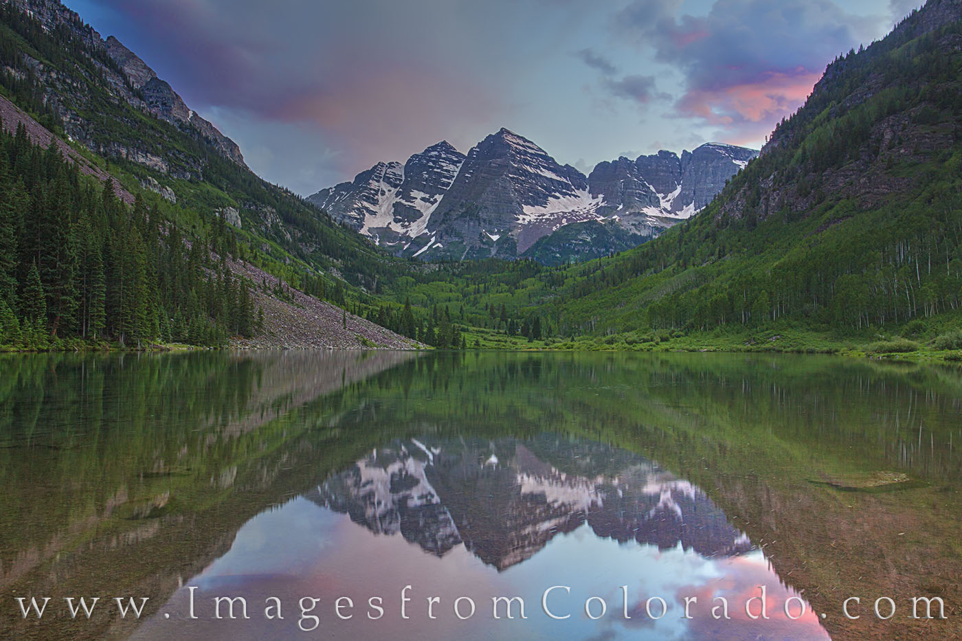 Evening falls across the Maroon Bells Wilderness Area near Aspen, Colorado. Maroon Lake was still and offered a great reflection...