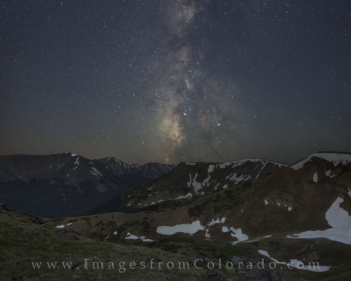 The Milky Way shines in the early morning hours over the Colorado Rocky Mountains. This view faces southwest from the Continental...