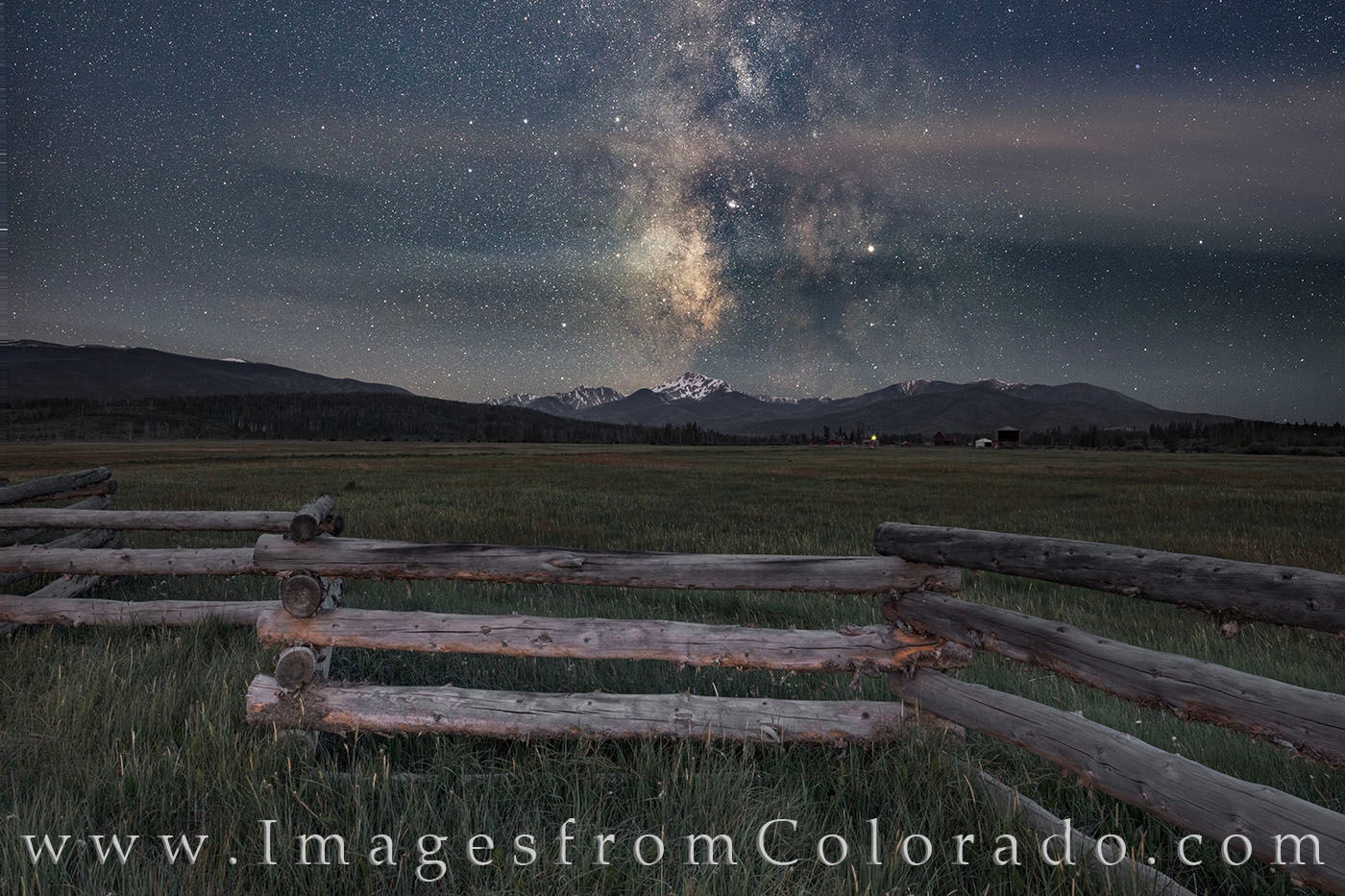 On a cold clear night in the Fraser Valley near Fraser and Winter Park, Colorado, the Milky Way rolls across the night sky. Facing...