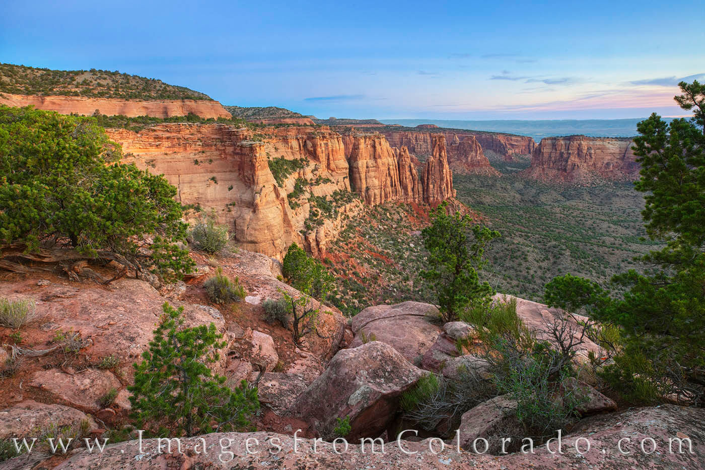Sunrise over Monument Canyon in Colorado National Monument is a beautiful time on the western slope of the Rocky Mountains. This...