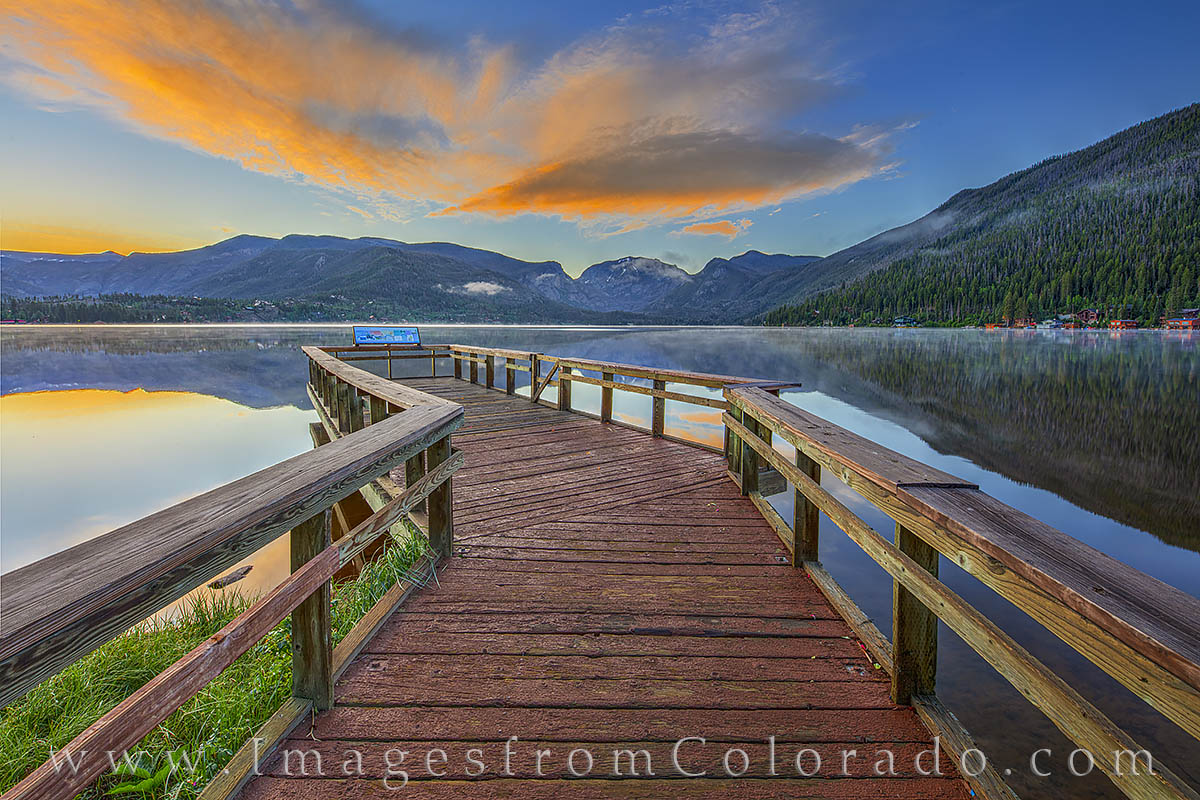 The pier at Point Park in Grand Lake, Colorado, offers a great place to take in the sunrise or sunset. Here, morning light spreads...