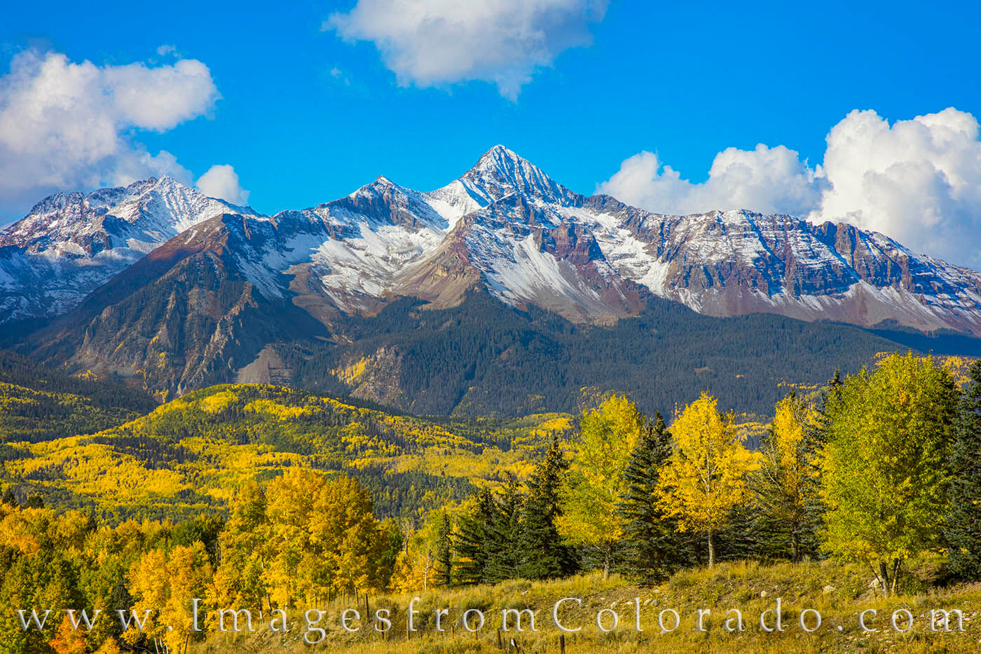 Along CR 145, the San Juan Mountains rise above the green and gold of a cold October morning. The aspen are stunning ths time...