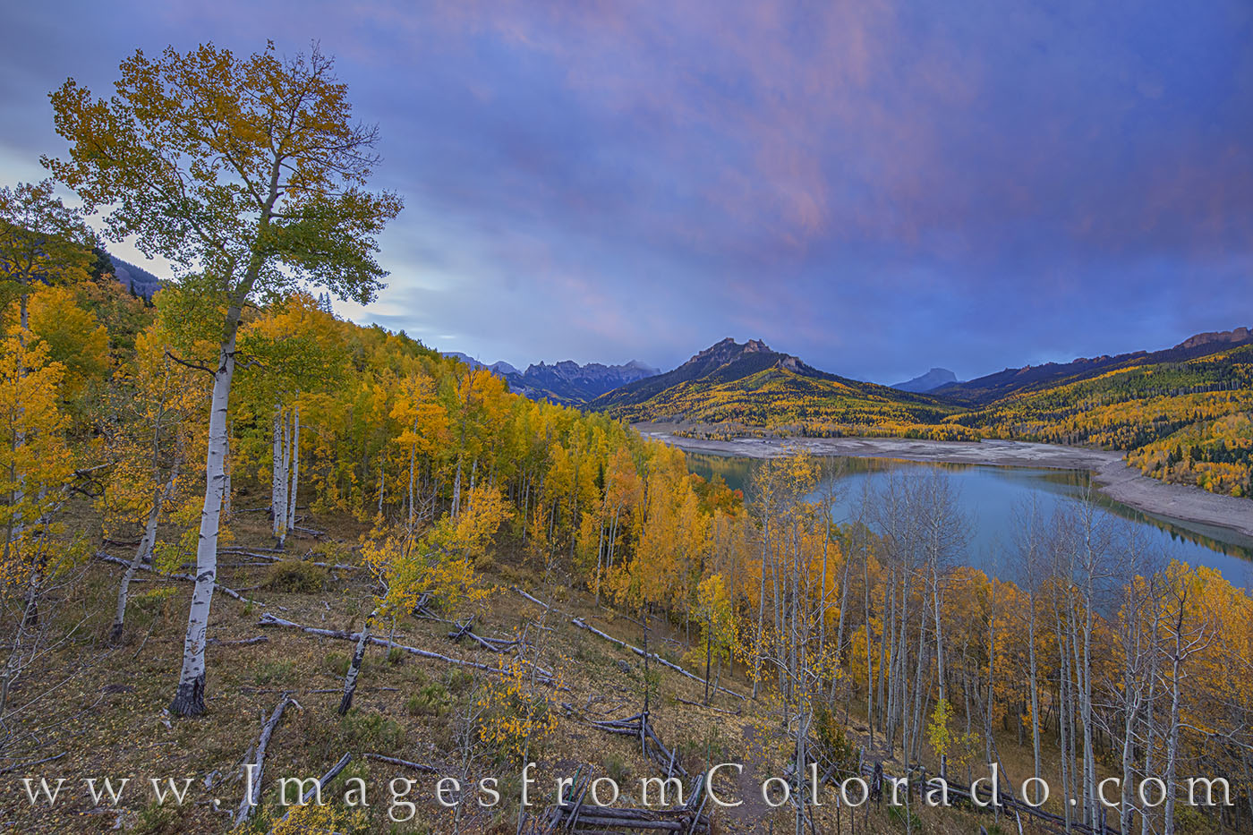 Silver Jack fall colors shine even well before sunrise as clouds race acros the sky on a cold October morning. Some aspen were...